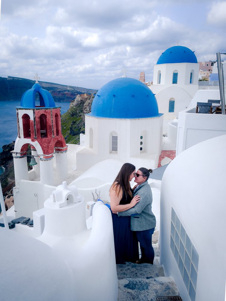 two women kissing in santorini