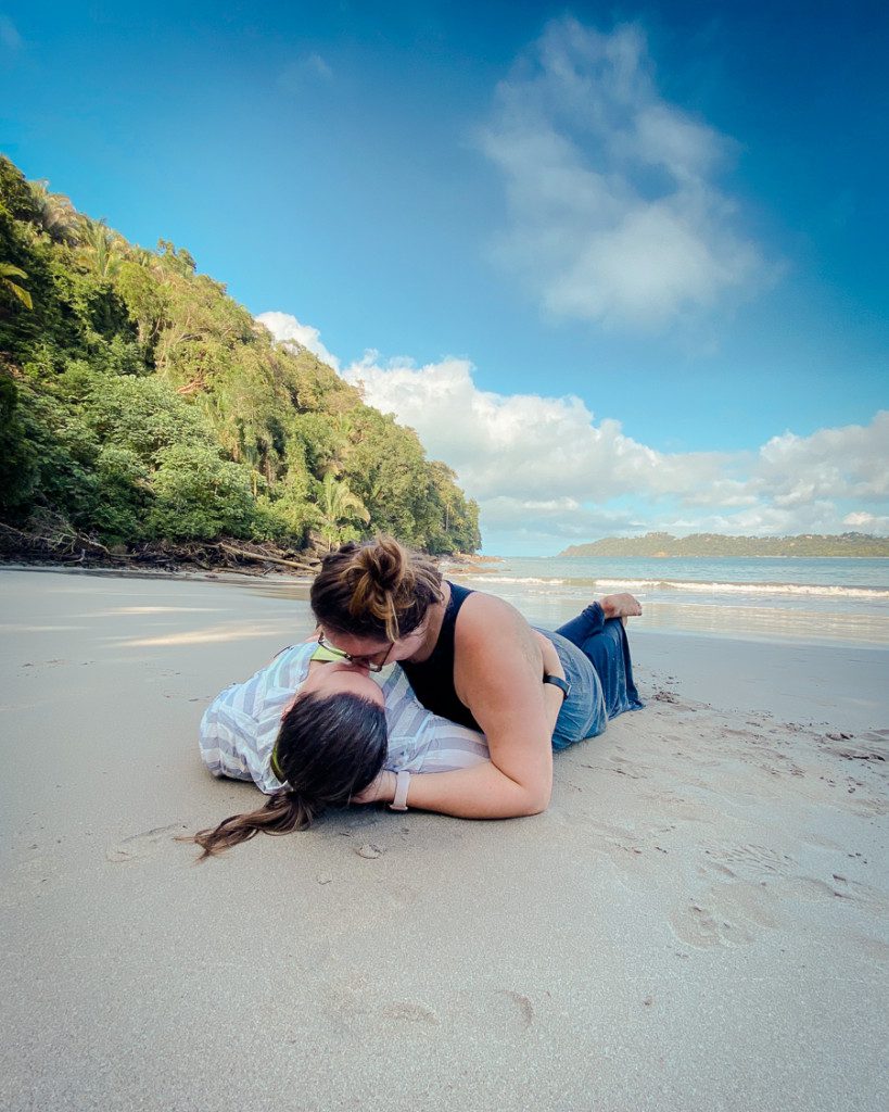 lesbian couple kissing on Manuel Antonio Beach