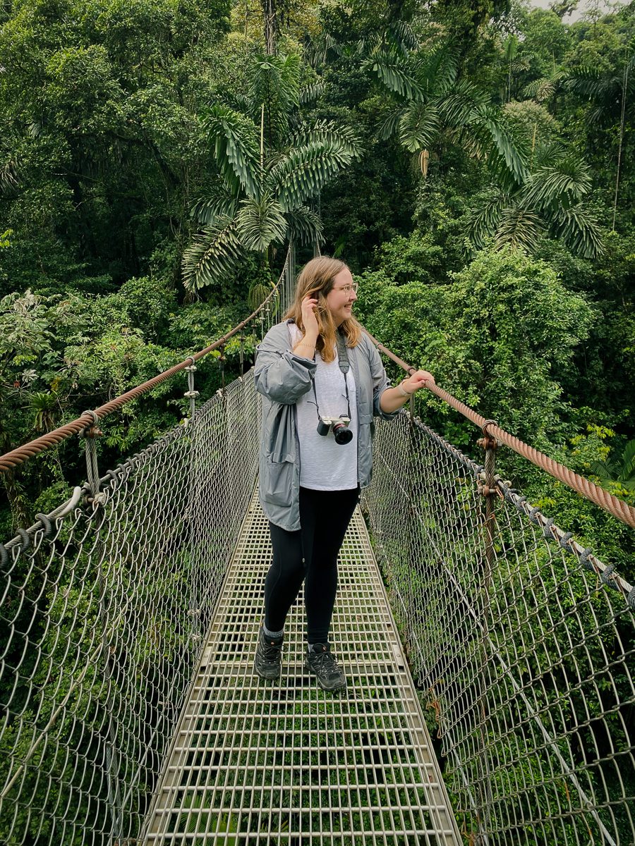 Woman smiling on Mistico hanging bridge